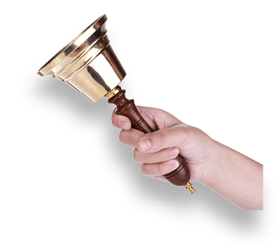 Gold retro school bell in hand isolated on white